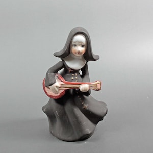 Vintage porseleinen non-beeldje: banjospeler, religieus decor