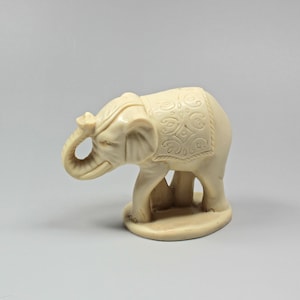 Vintage Beige Elephant Figurine: Carved Resin Safari Decor