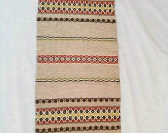 Vintage hand woven wool small rug.