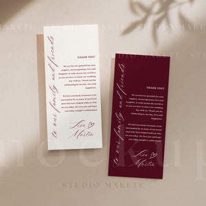 May include: Two white thank you cards with burgundy script text. The text reads "To our family and friends" and "Thank you! We are forever grateful for your support, encouragement, love and laughter. It truly means the world to us as you are here to share our wedding day with us. Thank you for celebrating in our love, love and happiness." The cards are signed "Lisa & Martin" with a small heart symbol.