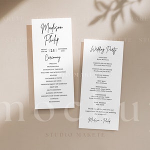 May include: Two white cards with black text. The first card lists the wedding ceremony order, including the processional, entrance of the bride, reading, exchange of vows, and more. The second card lists the wedding party, including the officiant, parents of the bride and groom, bridesmaids, groomsmen, and more. The text on the cards reads "Madison and Phipp" and "Wedding Party".