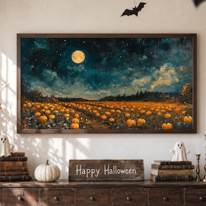 May include: A rectangular framed wall art print depicting a pumpkin patch under a full moon and starry night sky. Below the art, a wooden sign with the text Happy Halloween sits on a dark brown wooden cabinet with many small drawers.
