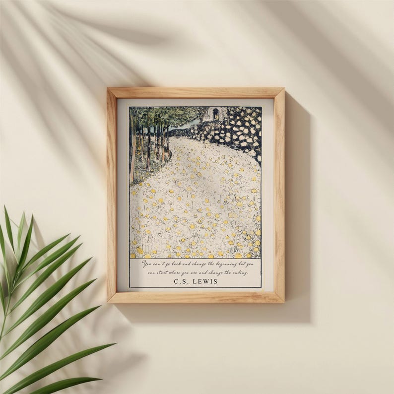 May include: A framed print with a quote by C.S. Lewis: "You can't go back and change the beginning, but you can start where you are and change the ending." The print features a painting of a path through a forest with yellow flowers.