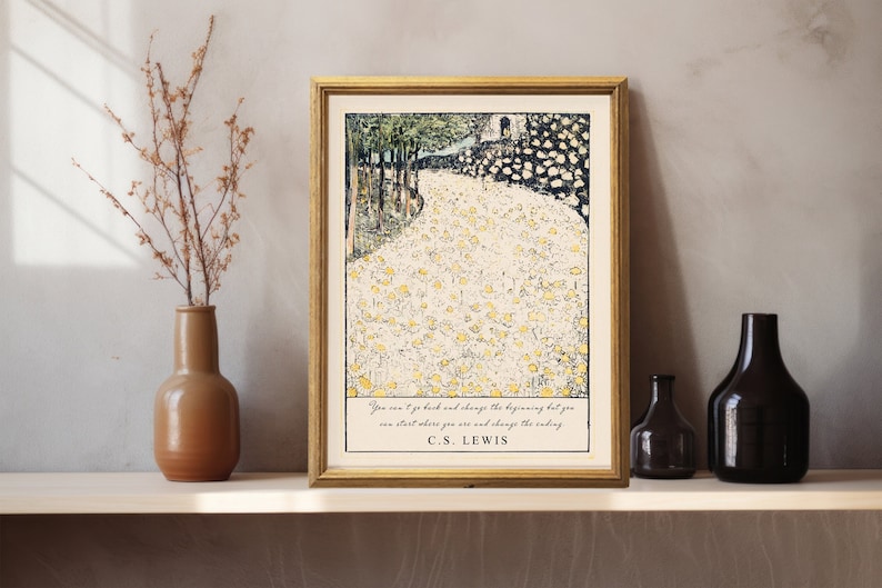 May include: A framed print with a quote by C.S. Lewis: "You can't go back and change the beginning but you can start where you are and change the ending." The print features a stylized illustration of a path lined with yellow flowers.