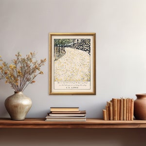 May include: A framed print with a quote by C.S. Lewis. The print features a black and white illustration of a path lined with white flowers. The quote reads "You are never too old to set another goal or to dream a new dream."