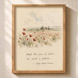 May include: A framed watercolor print featuring a field of red poppies and a distant Tuscan-style villa. The artwork includes the quote, "Adopt the pace of nature: her secret is patience." by Ralph Waldo Emerson. The frame is made of light brown wood.