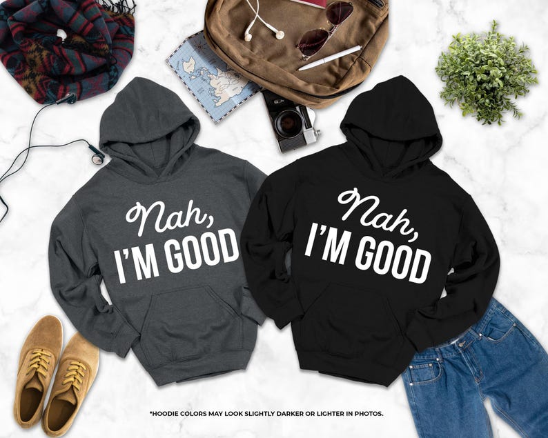 two hooded sweatshirts with the text " Nah, I'm good" printed on them, along with a pair of jeans, a pair of shoes, a backpack, and some other items.