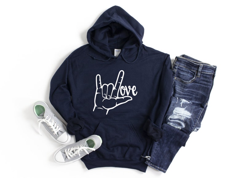 May include: Navy blue hooded sweatshirt with a white graphic of the American Sign Language symbol for "love" and the word "love" written in cursive.