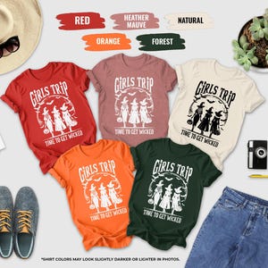 a collection of clothing items, accessories, and a plant, arranged in a visually appealing manner.