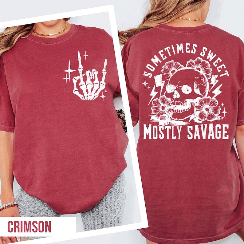 a red t-shirt with a graphic design on the back, including a skull and floral elements, along with the text "Sometimes Sweet Mostly Savage".