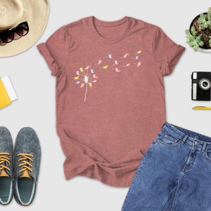 a women's t - shirt, jeans, hat, sunglasses, and other