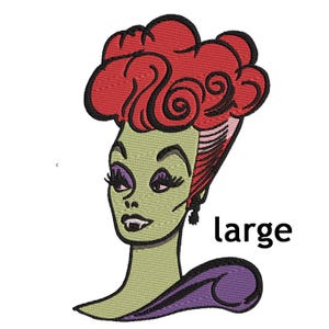 May include: Embroidered patch featuring a stylized green-skinned woman with red hair and purple eye shadow. The patch has the word "large" in black text. The woman has a purple collar and black earrings.