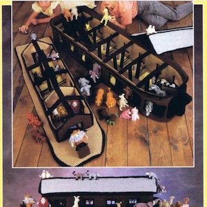 May include: A crocheted Noah's Ark playset with a brown wooden base and a gray roof. The ark is filled with crocheted animal figures, including lions, zebras, elephants, and birds. The ark is shown in two different positions, one with the roof open and the other with the roof closed.