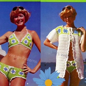 May include: A crochet bikini set with a matching crochet cover-up. The bikini top and bottom are green and white with blue flowers. The cover-up is white with green and blue flowers. The model is wearing the bikini and cover-up on a beach.