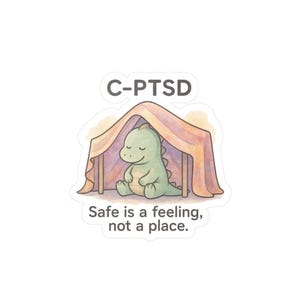 May include: A sticker with a green dinosaur under a tent, with the text "C-PTSD" above and "Safe is a feeling, not a place" below. The dinosaur is smiling with its eyes closed. The tent is in shades of pink and orange.