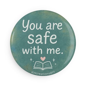 May include: Circular teal button featuring the white text "You are safe with me." A pink heart and an open book graphic are below the text. The button has a watercolour-like texture and the text "KHcreations817" is at the bottom.