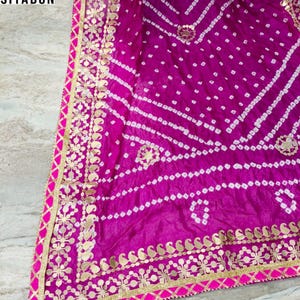 bandhani dupatta, bandhej dupatta, pink bandhani dupatta, gota patti dupatta, festive dupatta, traditional dupatta, Indian ethnic dupatta, wedding wear dupatta, rajasthani dupatta, gujarati bandhani, tie dye dupatta, lehenga dupatta, anarkali dupatta, silk bandhani dupatta
Bandhani Dupatta
Gota Patti Dupatta
Pink Dupatta
Indian Ethnic Wear
Festive Dupatta
Wedding Dupatta
Bandhej Dupatta
Rajasthani Dupatta
Traditional Dupatta
Tie Dye Dupatta
Party Wear Dupatta
Handmade Dupatta
Bandhej Dupatta