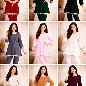 May include: A collection of women's loungewear sets in various colors, including red, green, black, gray, pink, white, brown, and purple. Each set features a tunic top with a round neckline and three-quarter sleeves, paired with matching pants. The tops have a decorative trim.