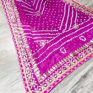 bandhani dupatta, bandhej dupatta, pink bandhani dupatta, gota patti dupatta, festive dupatta, traditional dupatta, Indian ethnic dupatta, wedding wear dupatta, rajasthani dupatta, gujarati bandhani, tie dye dupatta, lehenga dupatta, anarkali dupatta, silk bandhani dupatta
Bandhani Dupatta
Gota Patti Dupatta
Pink Dupatta
Indian Ethnic Wear
Festive Dupatta
Wedding Dupatta
Bandhej Dupatta
Rajasthani Dupatta
Traditional Dupatta
Tie Dye Dupatta
Party Wear Dupatta
Handmade Dupatta
Bandhej Dupatta