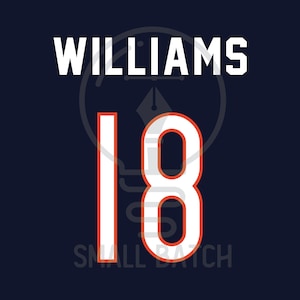 May include: Navy blue background with the name "WILLIAMS" in white block letters above the number "18". The number is white with an orange outline. The words "SMALL BATCH" are at the bottom.