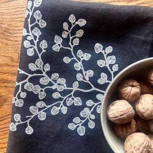 Hand printed ‘fagus’ (Nothofagus gunnii) 100% linen tea towel White on black