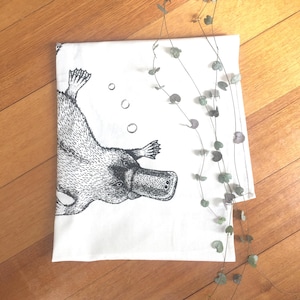Hand printed platypus tea towel