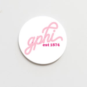 May include: White round sticker with a pink rope-style font that says "gphi est 1874".