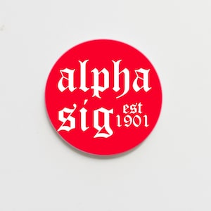 May include: A red circle with white text that reads "alpha sig est 1901".