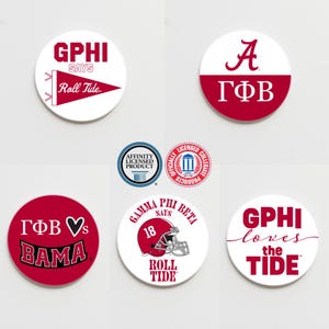 May include: Six round white and red stickers with various designs and text. The stickers feature the text "GPHI says Roll Tide", "A ГФВ", "ГФВ ♥s BAMA", "GAMMA PHI BETA SAYS 18 ROLL TIDE", "GPHI loves the TIDE", and "AFFINITY LICENSED PRODUCT".