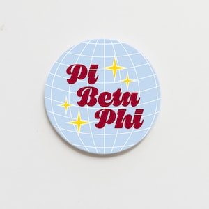 May include: A blue and white disco ball with the text "Pi Beta Phi" in maroon letters and yellow stars.