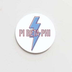 May include: White round sticker with a blue lightning bolt and the text "PI BETA PHI" in red.