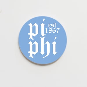May include: A light blue round sticker with white text that reads "Pi Phi est 1867" in a gothic font.