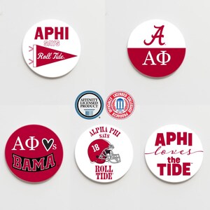 May include: Six round white and red coasters with various designs. The designs include the text "APHI says Roll Tide", "A AΦ", "AΦ♥s BAMA", "ALPHA PHI SAYS 18 ROLL TIDE", and "APHI loves the TIDE".