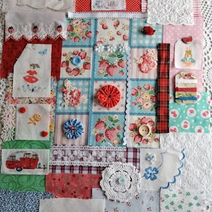 May include: A patchwork quilt composed of fabric squares with floral, strawberry, and gingham designs. It includes lace, buttons, and embroidery. The text "What a Wonderful World" is displayed on a small square.