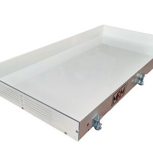 May include: A rectangular, clear acrylic tray with a white interior. The tray has a raised edge and is supported by a silver metal frame with wheels. The logo "MRM" is visible on the side.