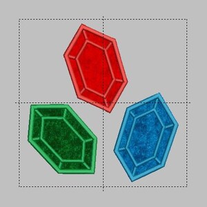 May include: Three colorful, geometric, gem-shaped objects. The gems are red, green, and blue.