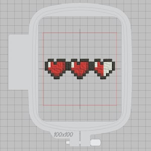 May include: A pixelated heart health bar with three hearts, two full and one half full, in a white embroidery hoop. The hoop is 100x100.
