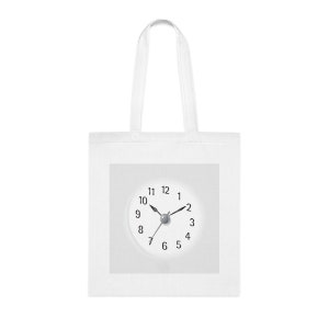 May include: White tote bag featuring a clock face design. The clock face has black numbers and hands, and a grey centre.