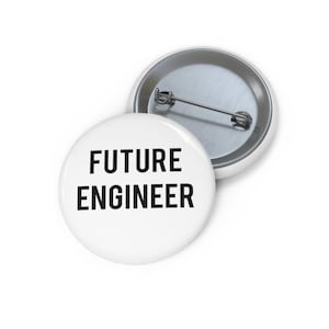 May include: White button with black text that reads "FUTURE ENGINEER".