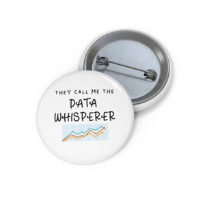 May include: White button with black text that reads "They call me the DATA WHISPERER" with a line graph in blue, orange, and yellow.