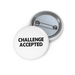 May include: White button with black text that reads "Challenge Accepted".