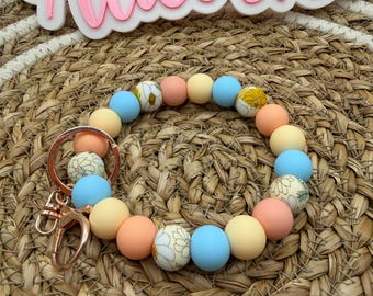 Porte-clés fleuri avec bracelet