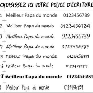May include: Image showcasing font styles with the text "CHOISISSEZ ICI VOTRE POLICE D'&Eacute;CRITURE" and "Meilleur Papa du monde" in various fonts. Numbers and symbols are also displayed, offering a selection of typography options.