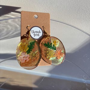 Handcrafted resin dangle earrings with dried flowers oval, gold green pink color