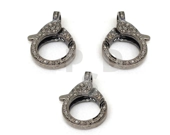 May include: Three silver-toned clasps with a round shape and a diamond-like pattern. The clasps are designed for jewelry making.