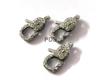 May include: Three silver-toned lobster clasps with clear cubic zirconia stones. The clasps are designed for jewelry making.