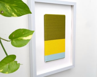 Handcrafted Fiber Art: Modern Textile Wall Hanging in White Frame