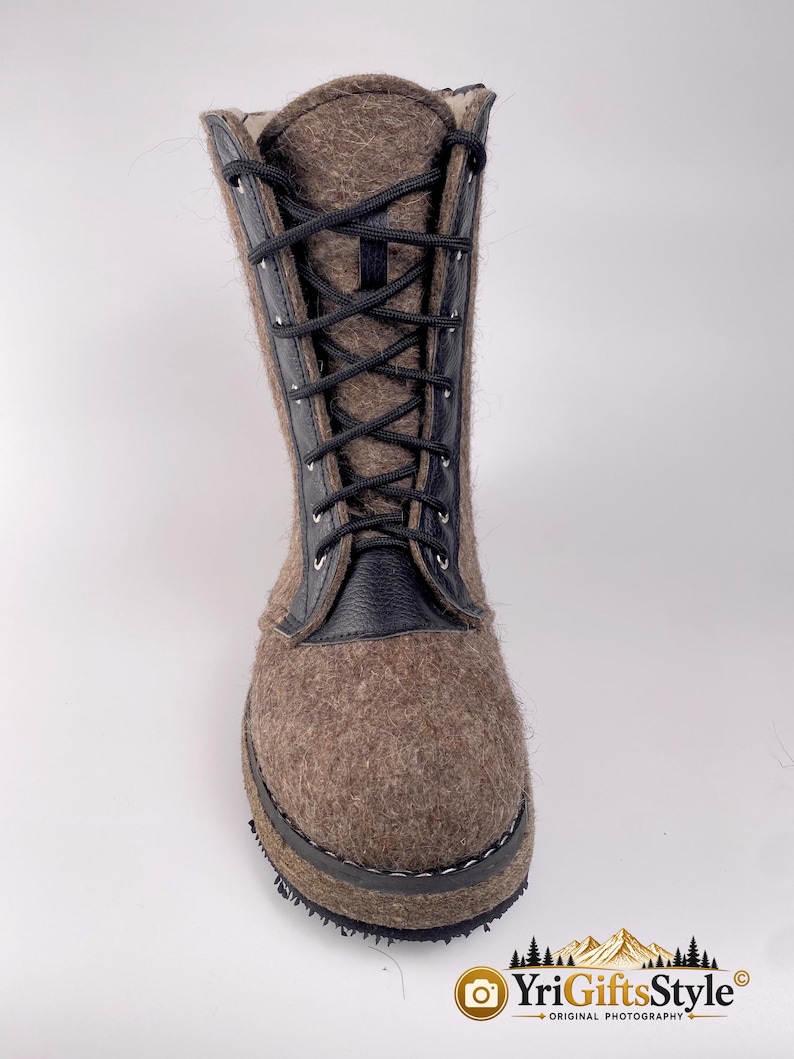 May include: A mid-calf boot crafted from brown felted wool with black leather trim along the lace-up front. The boot features black laces threaded through silver-toned metal eyelets and a thick, dark-colored sole. The text YriGiftsStyle is visible.