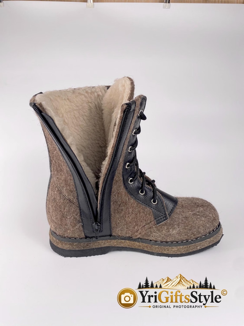 May include: A mid-calf boot featuring a brown felted wool exterior, a black leather lace-up front with silver eyelets, and a black side zipper. The interior is lined with cream-colored faux fur, and the boot sits on a thick black rubber sole.