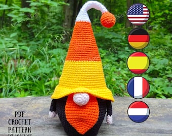 May include: Crochet pattern for a candy corn gnome. The gnome is wearing a white, orange and yellow hat and has a black beard. The pattern is available in PDF format. The image also includes flags of the United States, Germany, Spain, France and the Netherlands.